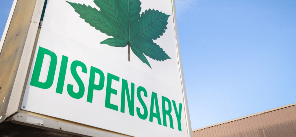 Ascendance dispensary and CBD social media marketing. Image of storefront and large dispensary sign with marijuana leaf