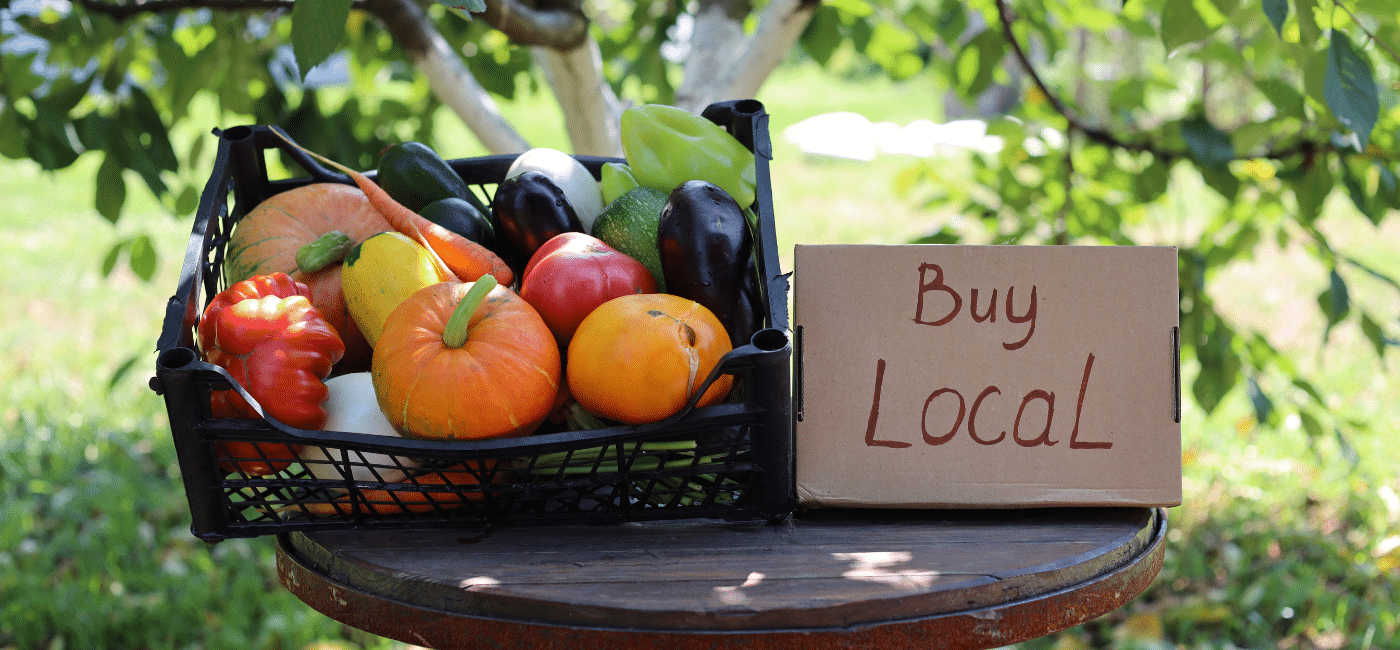 photo of fruit basket with buy local sign supporting local business with local business marketing
