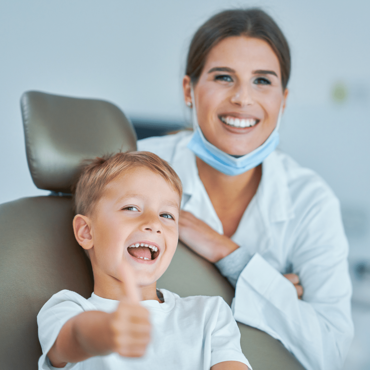 photo of lady dentist and child patient smiling thanks to Ascendance, dental marketing agency