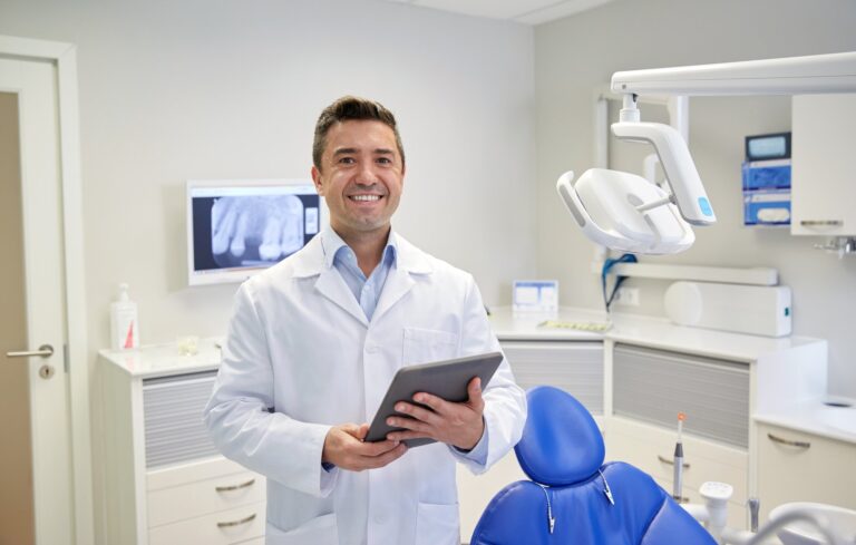 image of dentist working in office wanting to get more patients with SEO for dentists.
