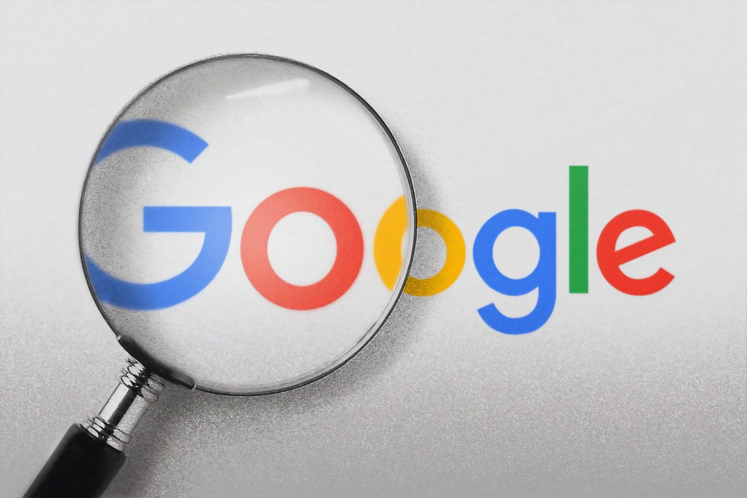 photo with magnifying glass over the google logo displaying google ads strategy