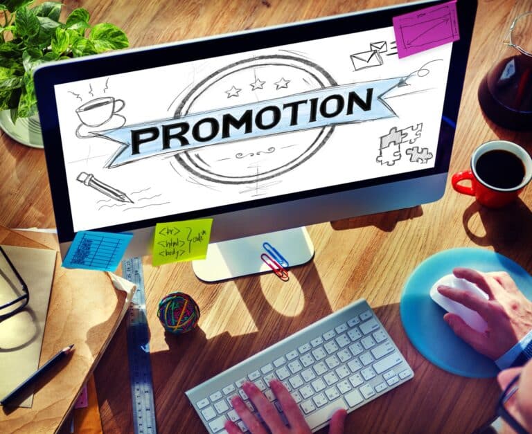 image of desktop on a desk showing a promotion page