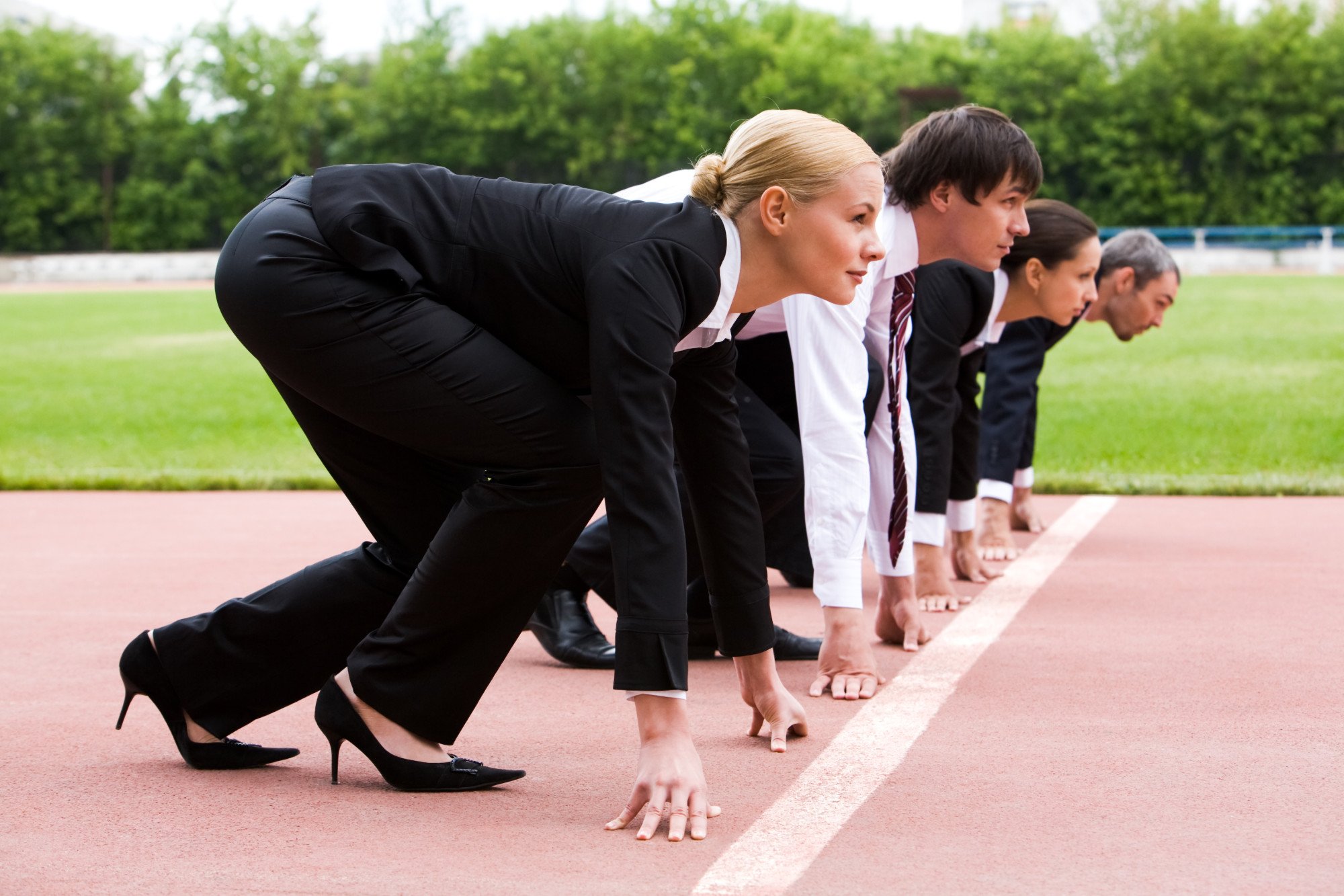image of business men and women competing in a race resembling SEO competitors