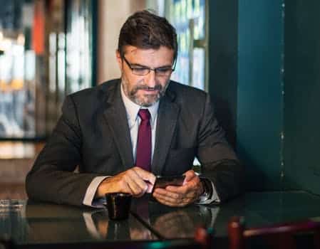 photo of lawyer on his phone learning about ppc for lawyers
