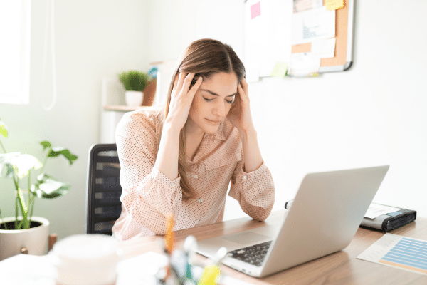 photo of overwhelmed online reputation management expert looking at online reviews
