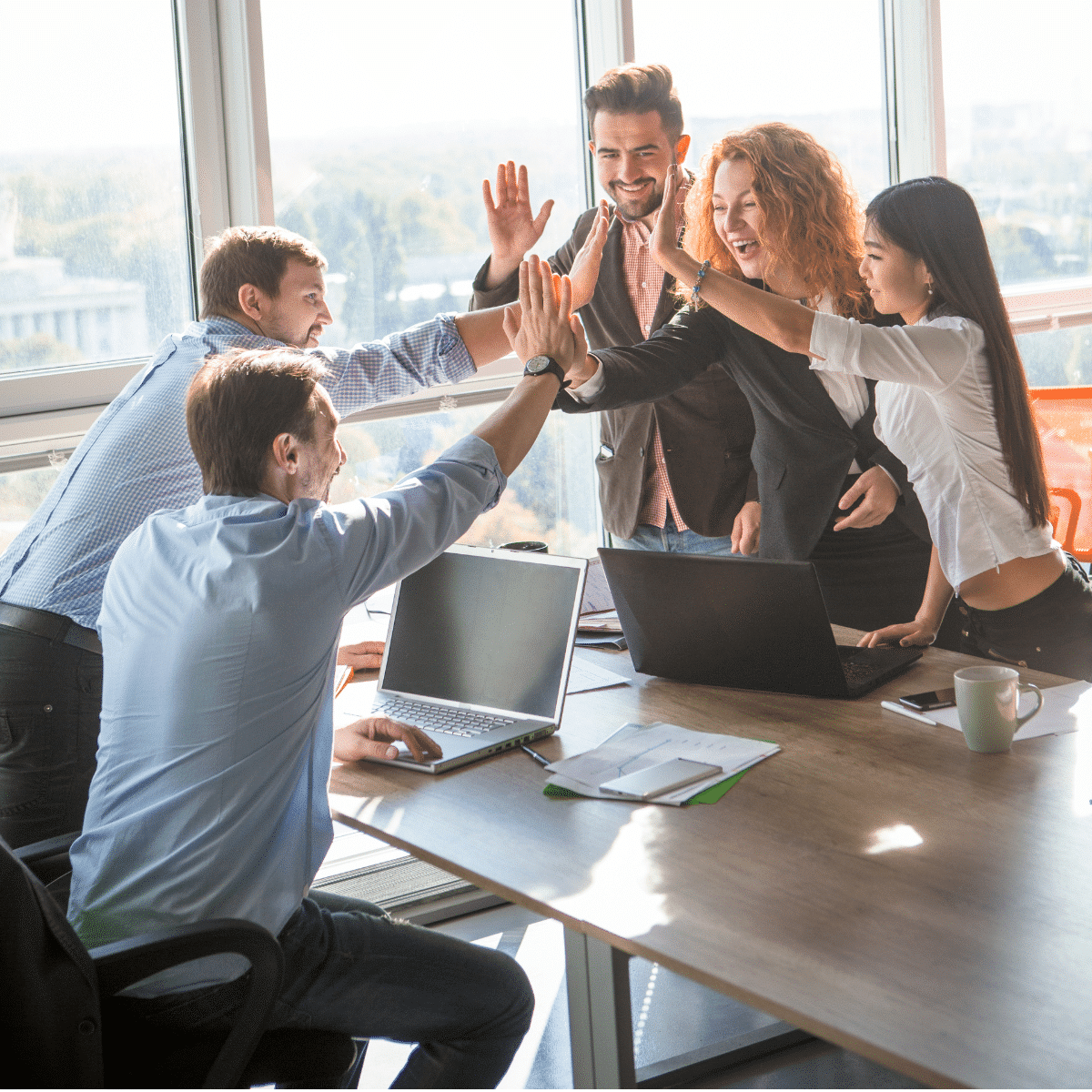 photo of san diego social media marketing team celebrating a successful campaign