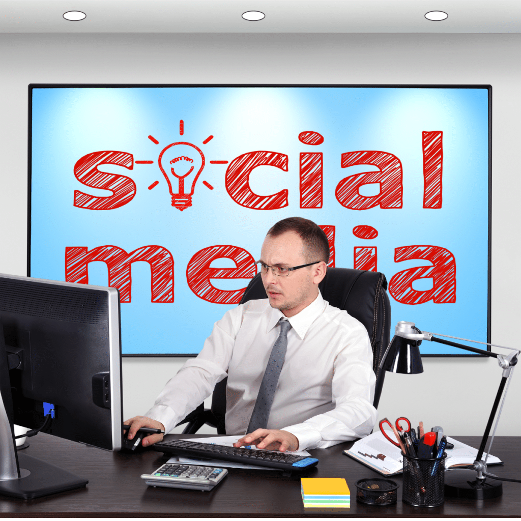 photo of man working on social media management san diego at his office