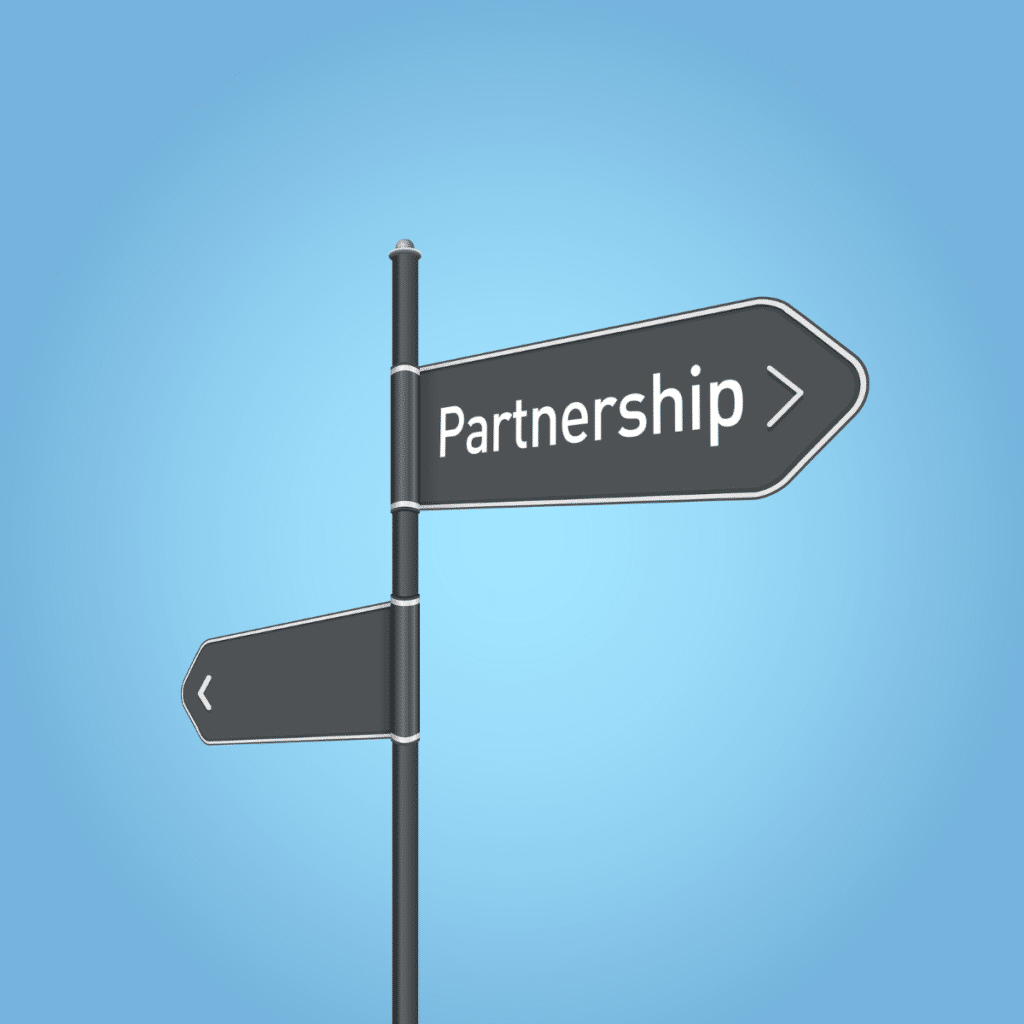 photo of sign reading "partnership" for marketing services referral