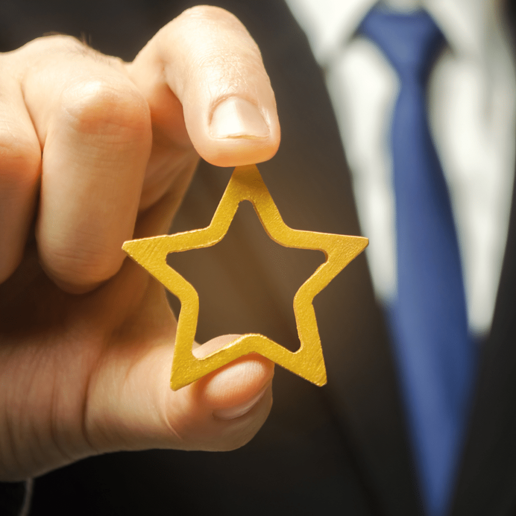 photo of man holding a star representing franchise reputation management