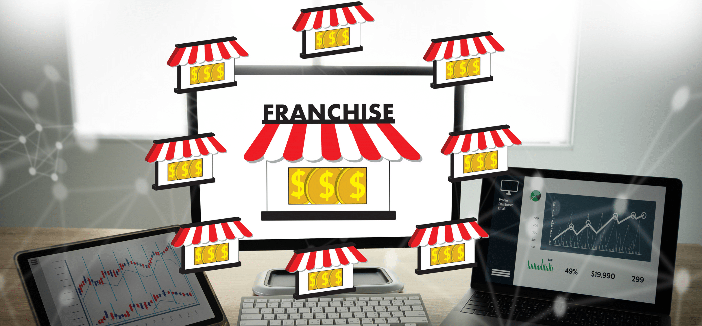 graphic showing franchise marketing agency with two laptops and a digital laptop with franchise locations