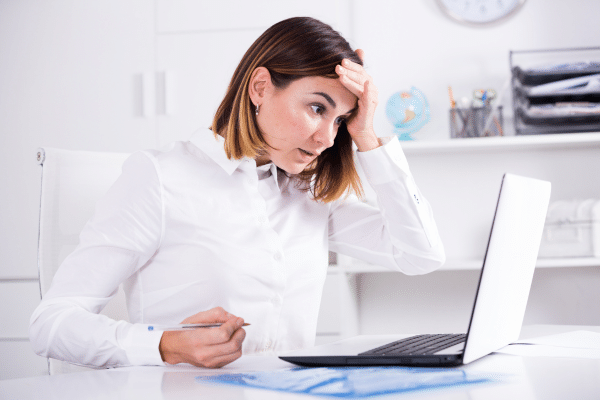 photo of perplexed woman on laptop facing local seo for franchises challenges