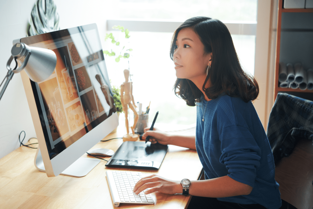 photo of woman actively shopping at an ecommerce web design on her laptop thanks to user engagement