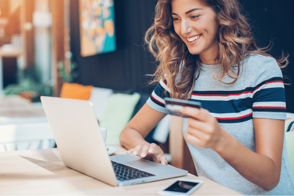 photo of woman happily shopping on a user friendly ecommerce web design