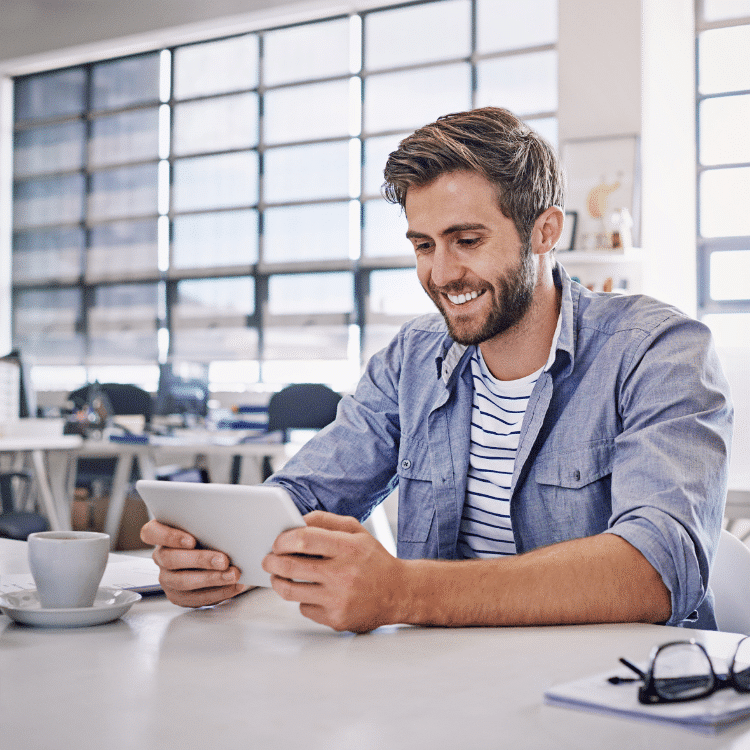 photo of man on tablet shopping on a website with great website navigation